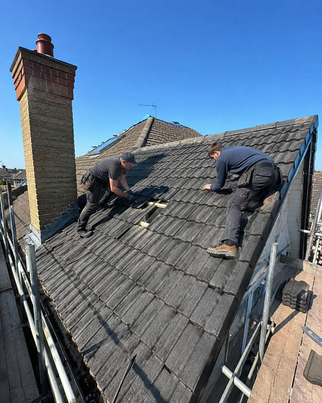 Roofers working on roof repairs